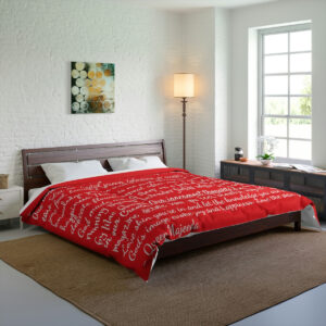 Red comforter with white lettering - verses by Queen Majeeda.