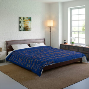 Poetry written in gold on this royal blue comforter designed by poet, Queen Majeeda.